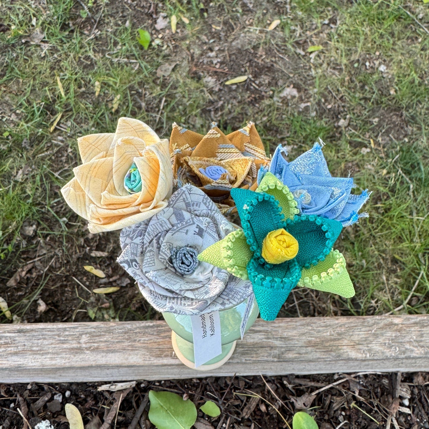Colorful fabric flowers arranged in vase