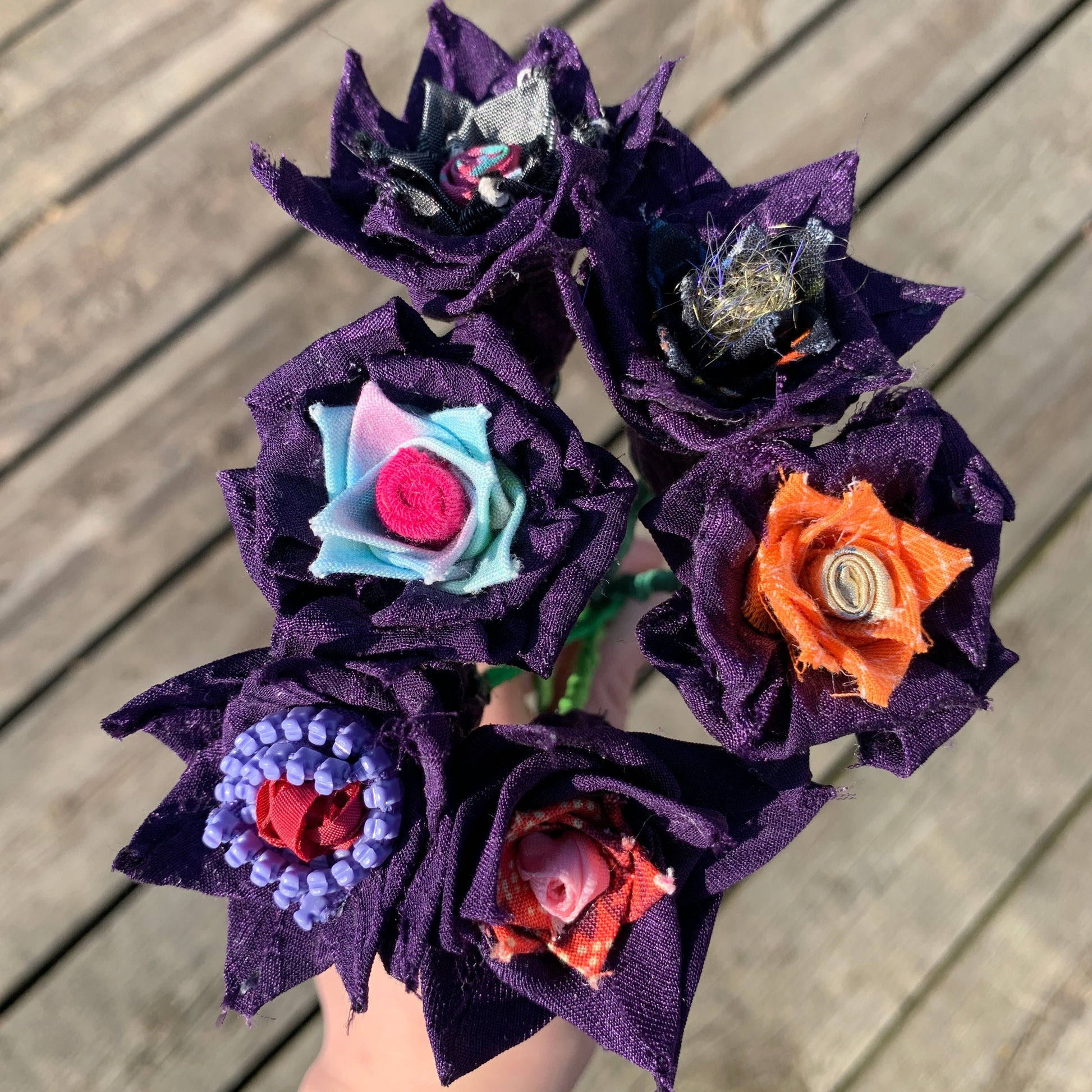 Purple flowers created from a silk blouse