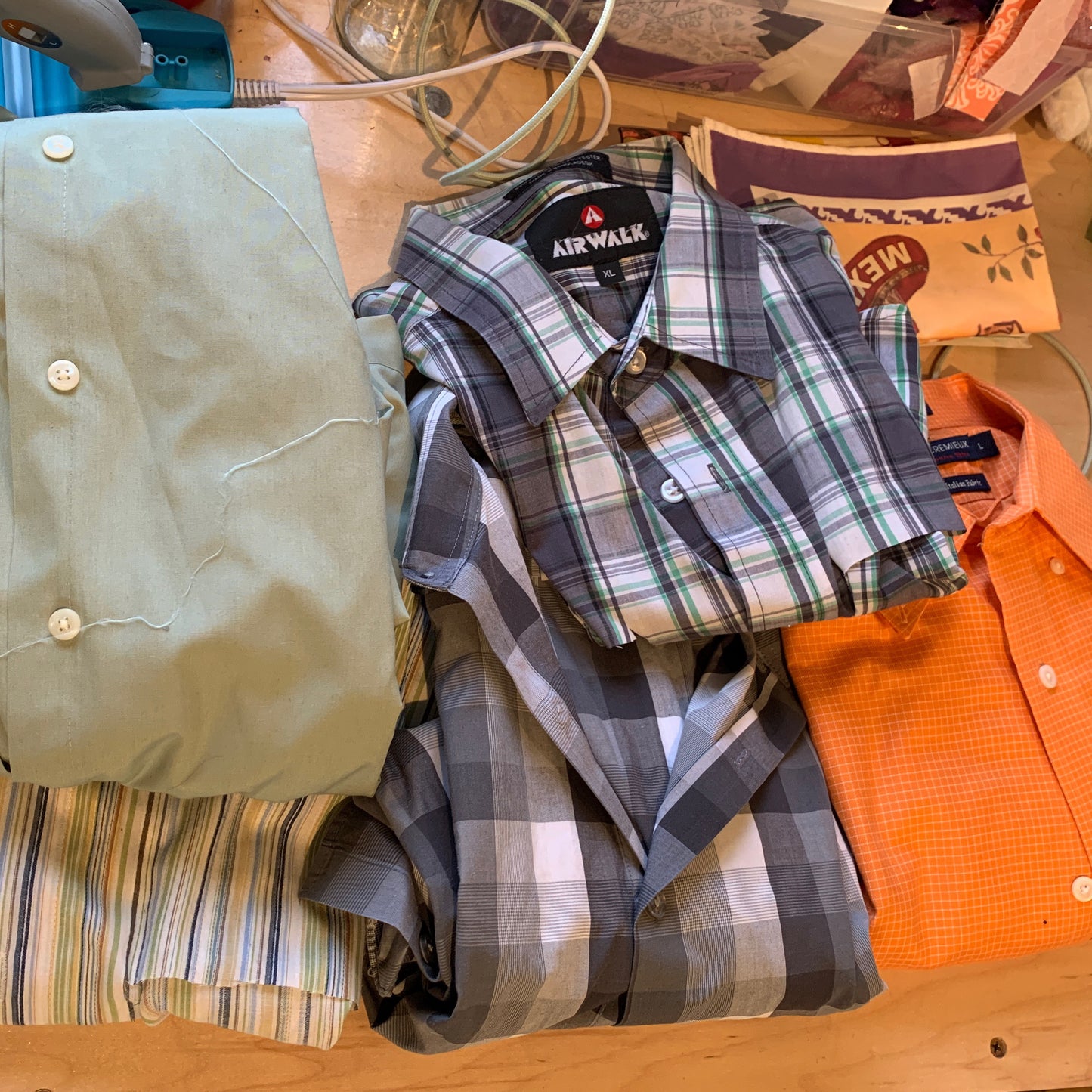 A stack of shirts that were used to create a gift of memorial flowers