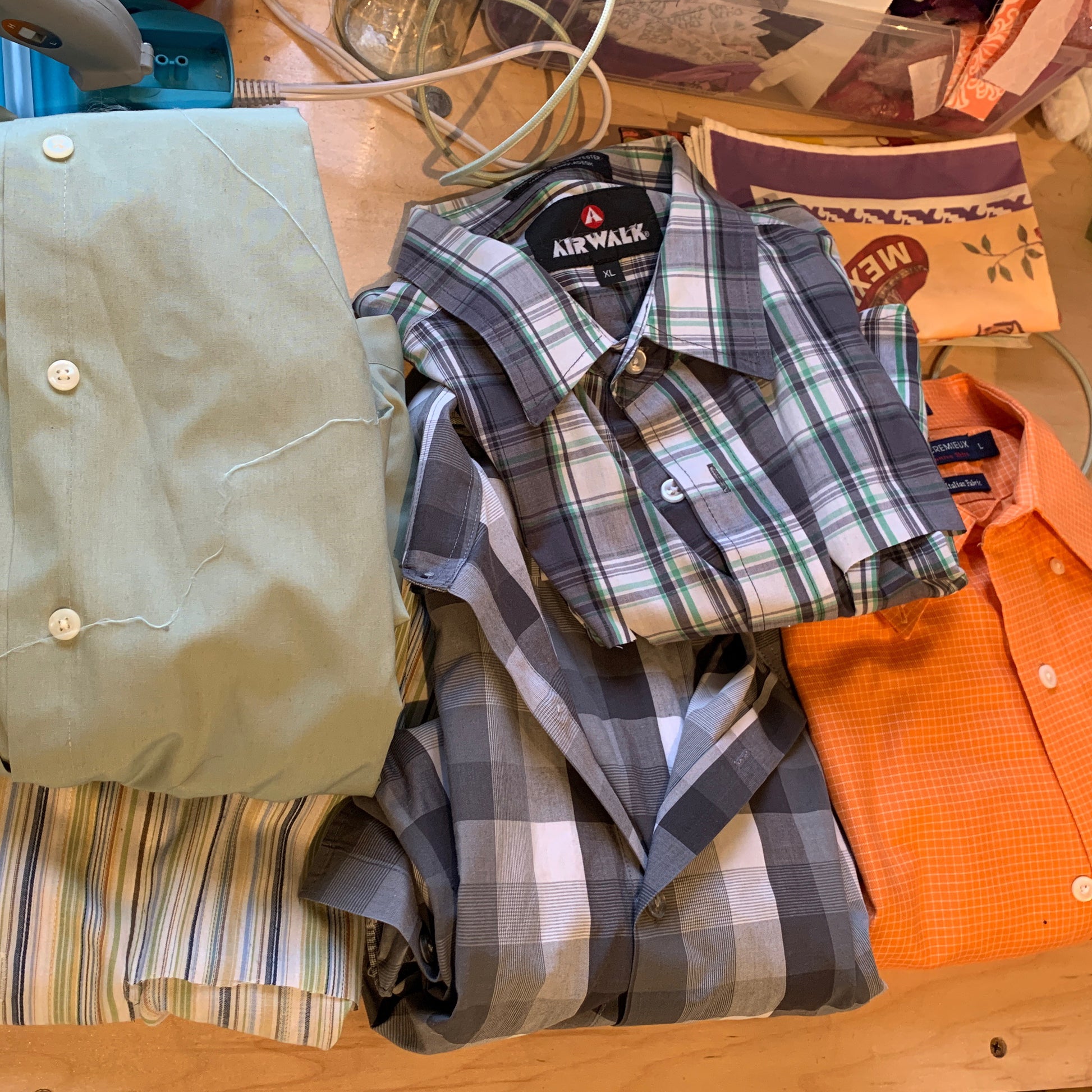 A stack of shirts that were used to create a gift of memorial flowers