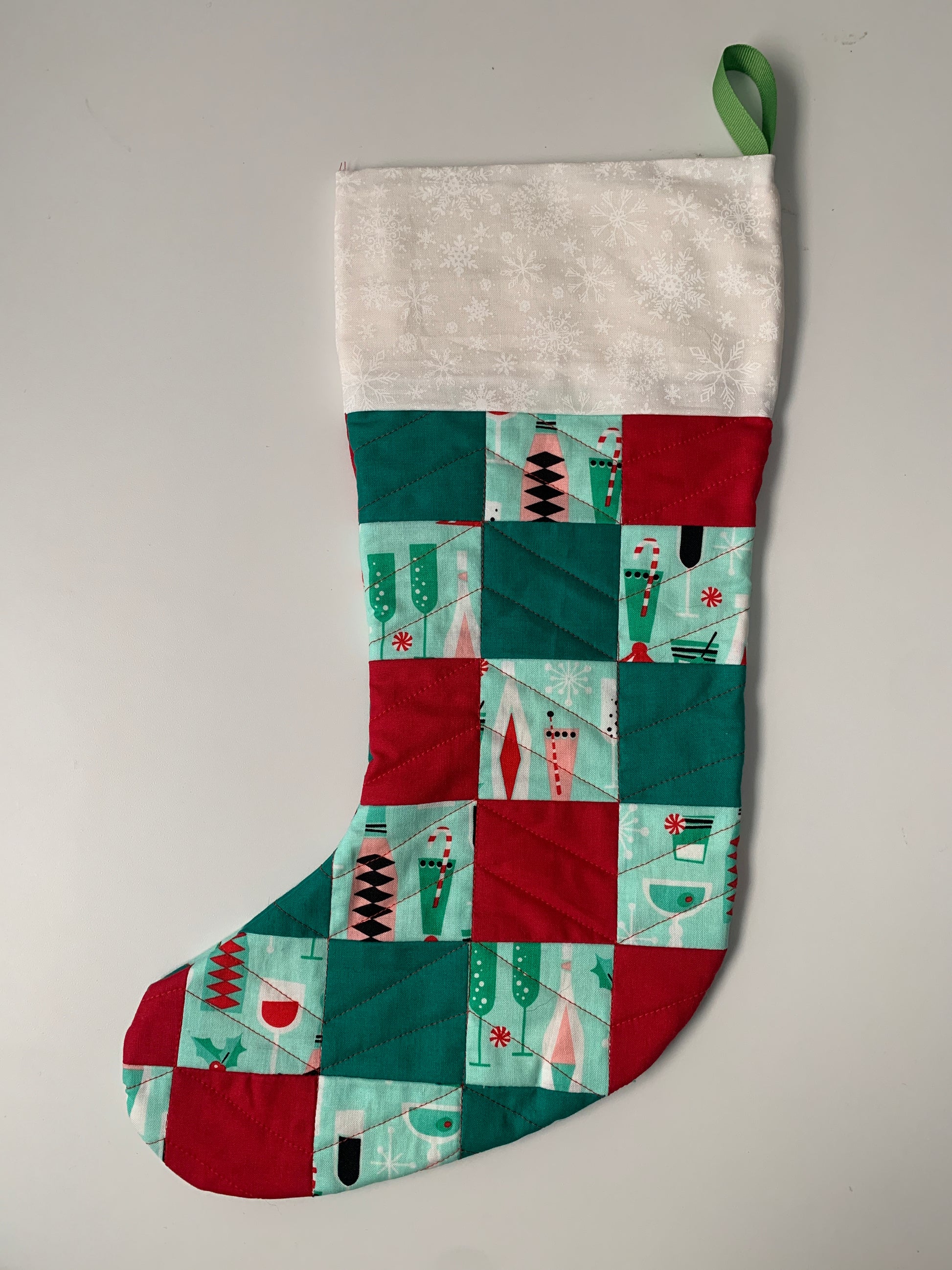 Christmas stocking with alternating red and green patchwork