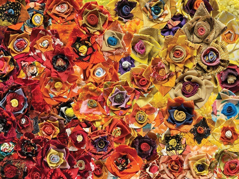 A yellow and orange gradient made up of photos of flowers