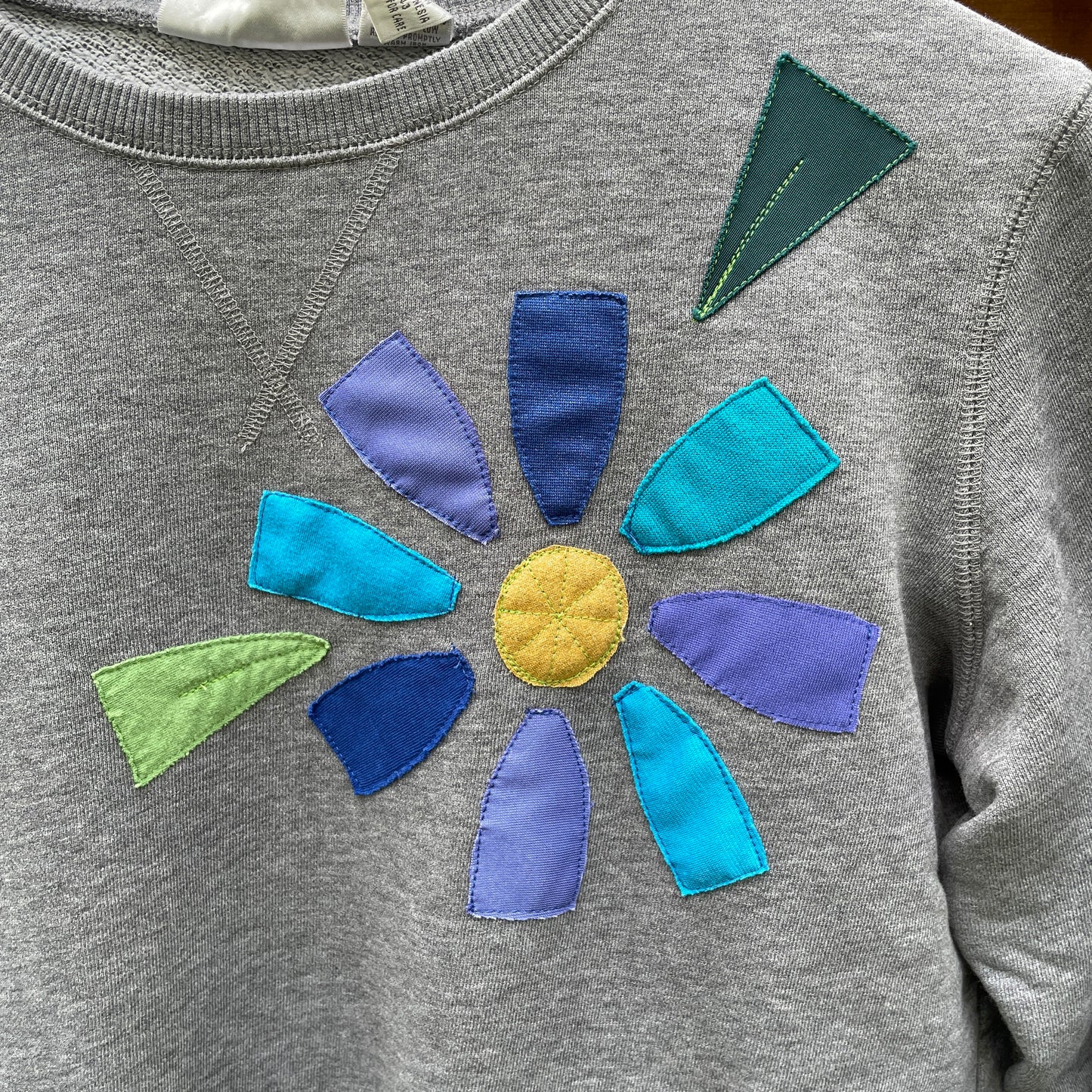 Grey Sweatshirt with Floral Appliqué (size small/medium)