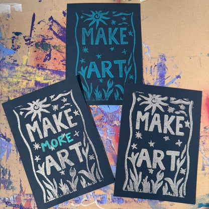 Three black cards with white and blue text reading "Make Art"