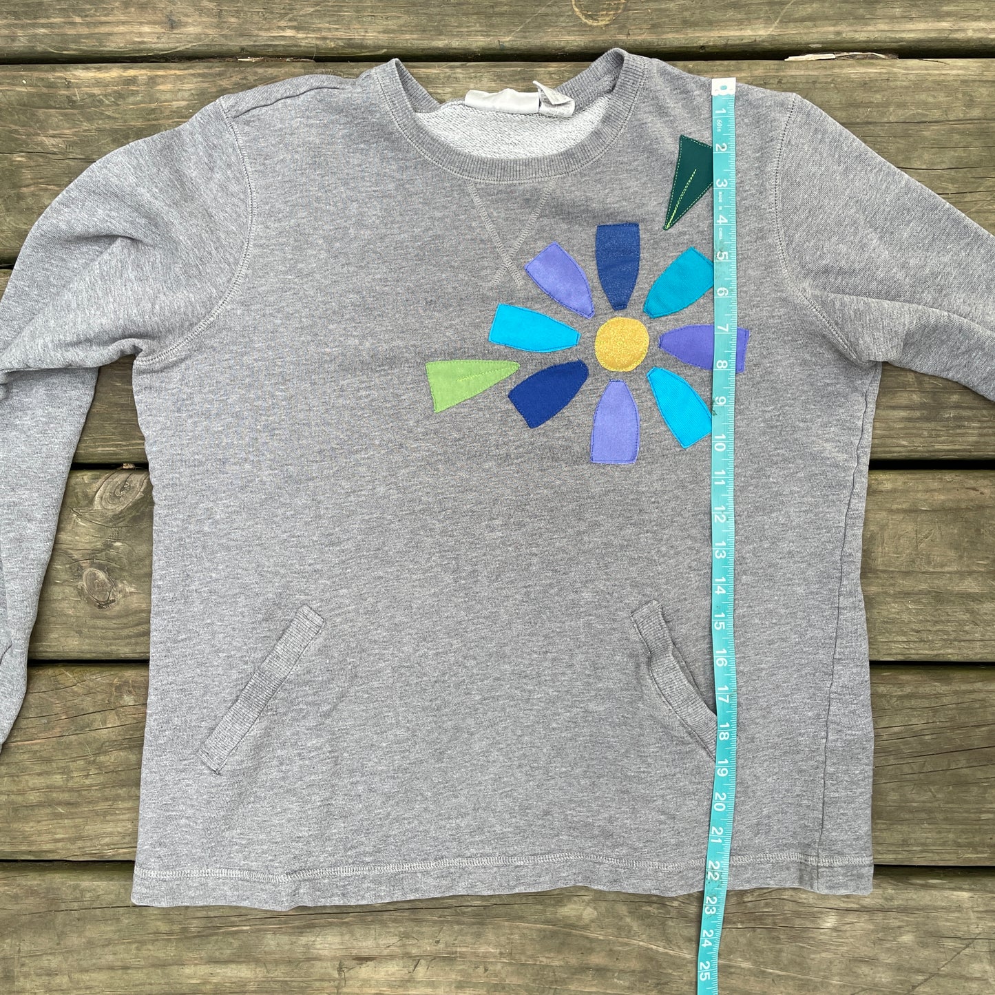 Grey Sweatshirt with Floral Appliqué (size small/medium)