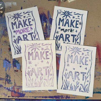 Multiple white cards with purple and blue text reading "Make Art"