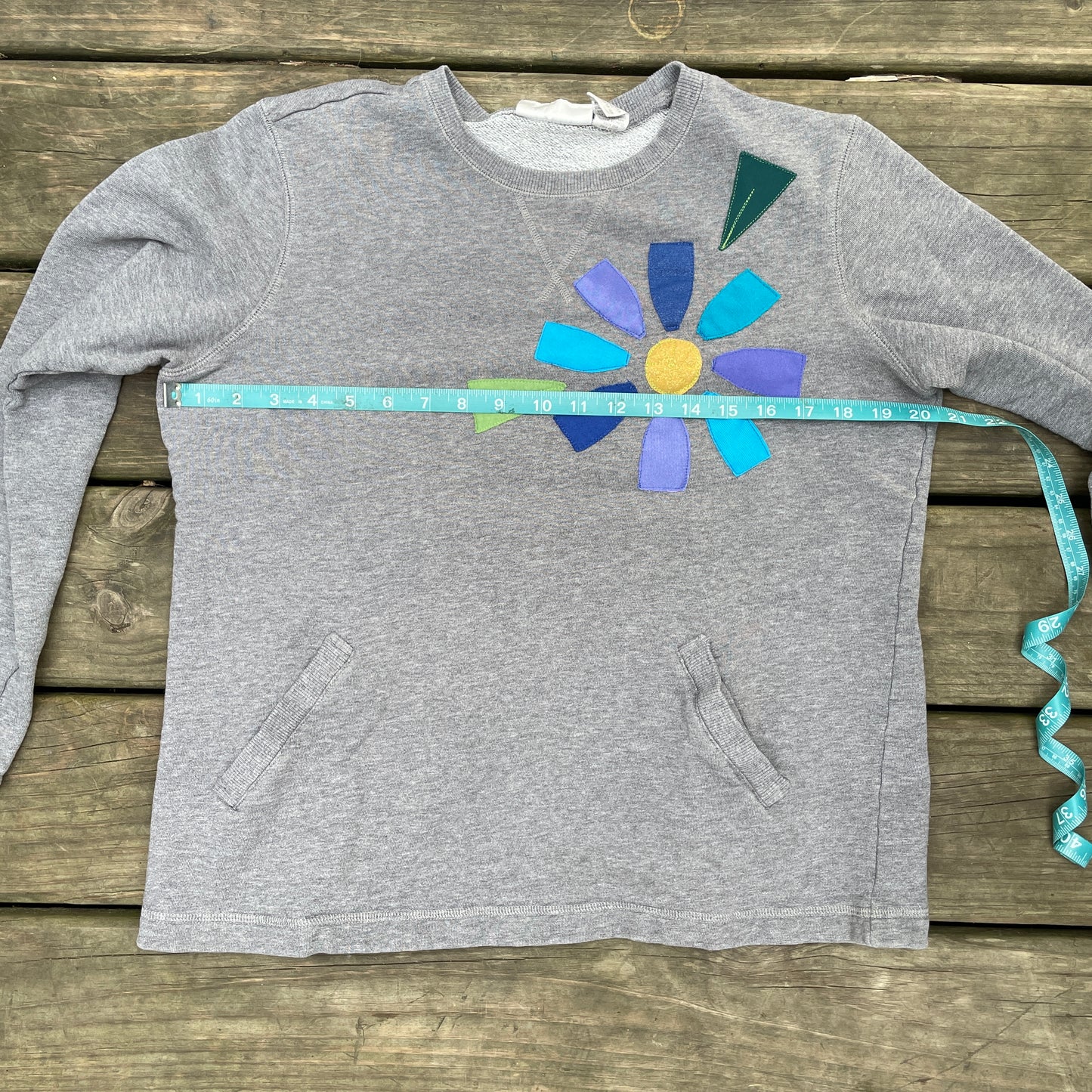 Grey Sweatshirt with Floral Appliqué (size small/medium)