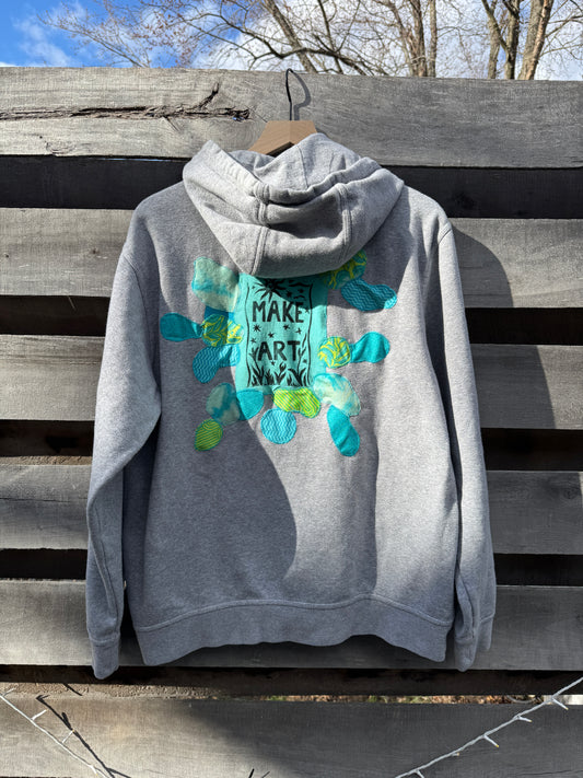 Grey Hoodie with "Make Art" and appliqué (size l)