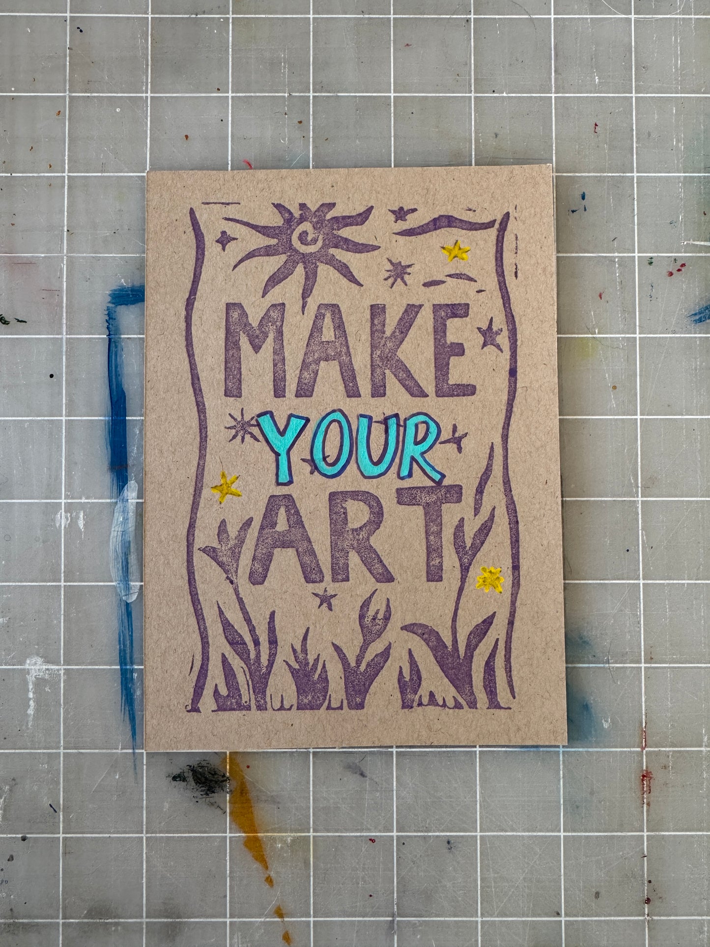Card with 'Make Your Art' text on a grid background