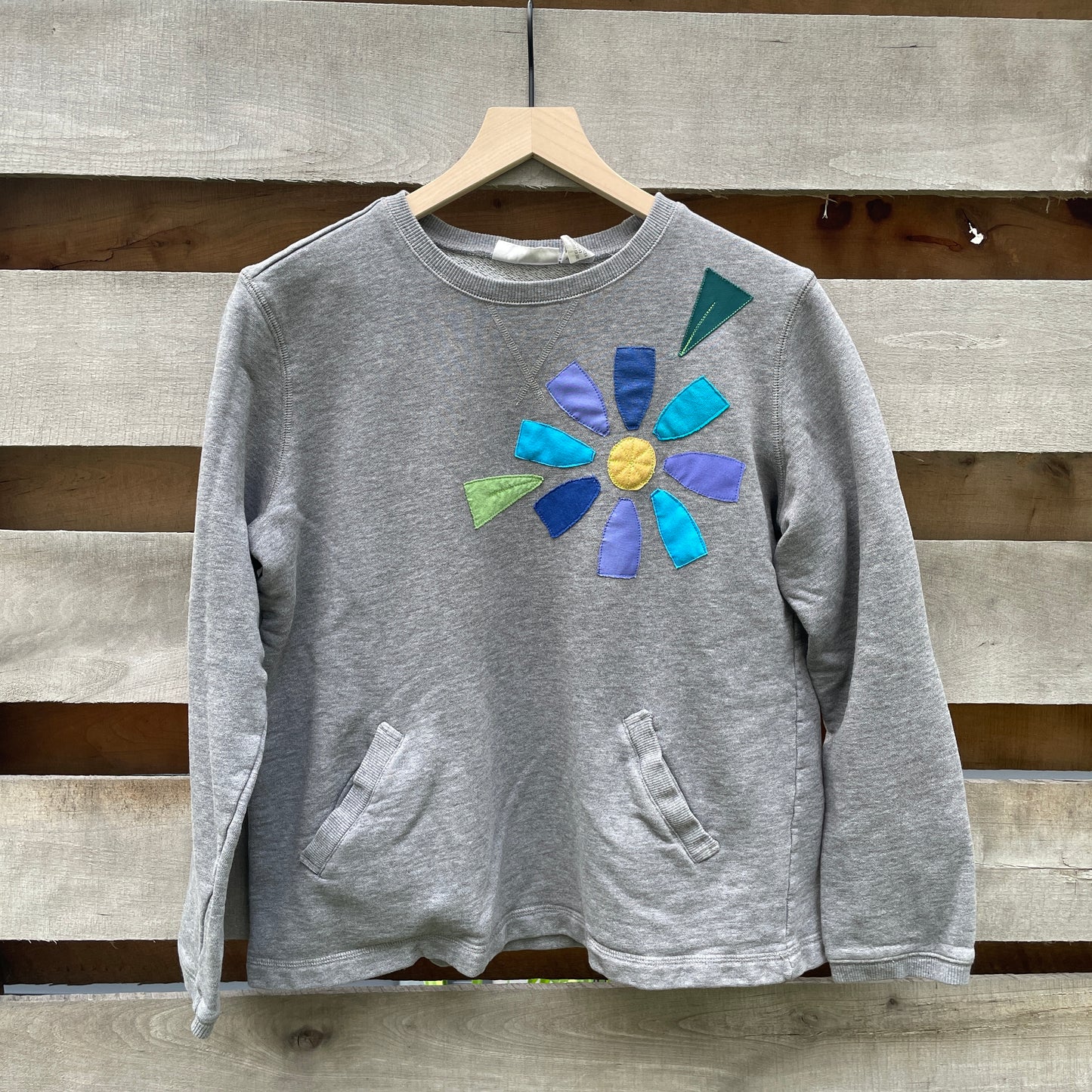 Grey Sweatshirt with Floral Appliqué (size small/medium)