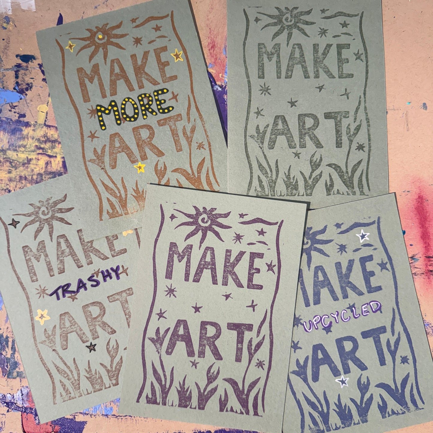 Multiple green cards with text reading "Make Art" in different colors