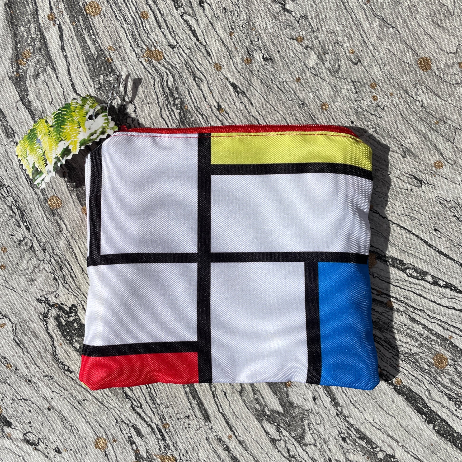 Mondrian inspired fabric with white, red, blue, and black