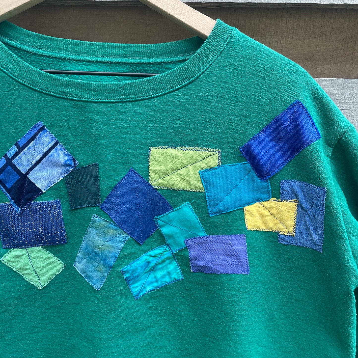 Green Sweatshirt with Abstract Appliqué (size L)