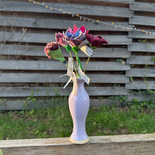 Colorful fabric flowers arranged in vase