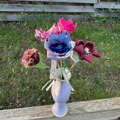 Colorful fabric flowers arranged in vase