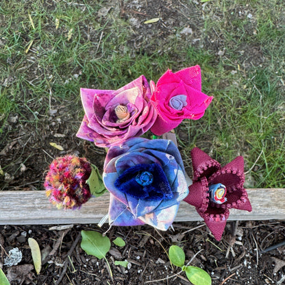 Colorful fabric flowers arranged in vase