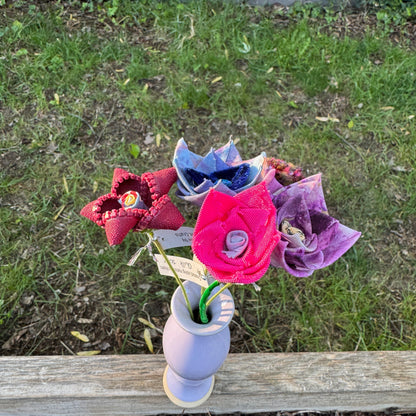 Colorful fabric flowers arranged in vase